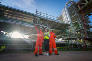 Refinery industry engineer are working and discussing at front oil and gas industrial factory,Oil refinery plant for industry..